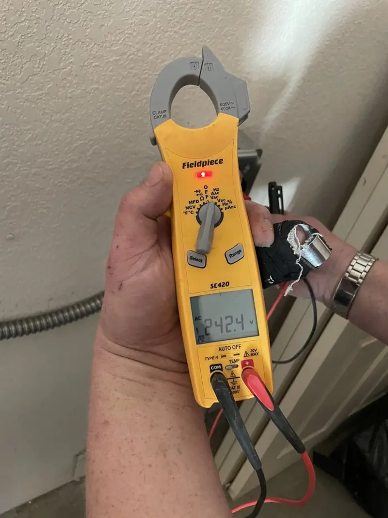 Voltage testing with clamp meter during Electrical Installation Services in Hubbard